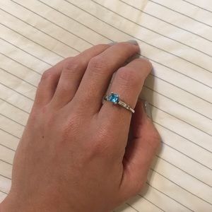 Blue topaz princess-cut ring with baguette CZ